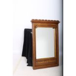 AN OAK GOTHIC FRAME MIRROR the rectangular plate within a moulded frame with carved berries to the