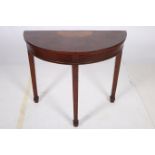 A WALNUT AND SATINWOOD SIDE TABLE of demilune outline the shaped top with panelled frieze on square