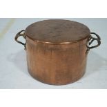 A LARGE COPPER LIDDED SAUCEPAN with carrying handles bears a stamp Board of Works 28cm (h) x 51cm