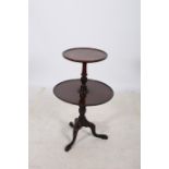 A GEORGIAN DESIGN MAHOGANY TWO TIER GRADUATED DUMB WAITER the circular dish top above a carved and