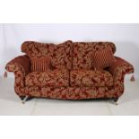 A THREE SEATER SETTEE 200cm (w) together with a footstool 38cm (h) x 114cm (w) x 53cm (d) EN-SUITE