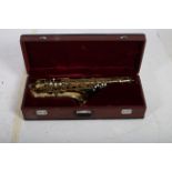 A BRASS SAXOPHONE in travelling case