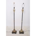 A PAIR OF CONTINENTAL WHITE METAL AND GILT FLOOR STANDARD LAMPS with cylindrical columns above a