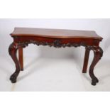 A GOOD 19TH CENTURY CARVED MAHOGANY SIDE TABLE of serpentine outline the shaped top with foliate
