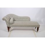 A 19TH CENTURY MAHOGANY AND UPHOLSTERED CHAISE LONGUE the shaped back with button upholstery and