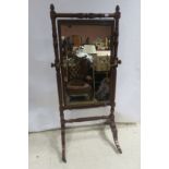 A VERY FINE REGENCY MAHOGANY CHEVAL MIRROR the rectangular plate within a spiral twist and leaf