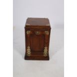 A 19TH CENTURY MAHOGANY AND BRASS BOUND FUEL BIN of square outline the stepped top above a hinged