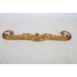 A 19TH CENTURY CONTINENTAL GILT METAL FENDER of serpentine outline with pierced C-scroll and