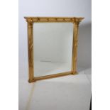 A REGENCY DESIGN GILTWOOD AND GESSO OVERMANTLE MIRROR of inverted breakfront outline the