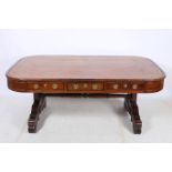 A FINE REGENCY MAHOGANY LIBRARY TABLE of rectangular outline with rounded corners and three frieze