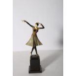 AFTER DEMETRE CHIPARUS A BRONZE AND POLYCHROME FIGURE modelled as an art deco dancer shown standing