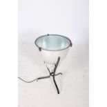 A WHITE METAL AND WROUGHT IRON UPLIGHTER of circular tapering form raised on tripod base 61cm x