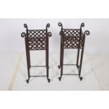A PAIR OF WROUGHT IRON JARDINIERE STANDS each of square form with scroll finials and lattice work