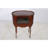 A CONTINENTAL MAHOGANY AND MARQUETRY SIDE CABINET of kidney shaped outline with pierced brass