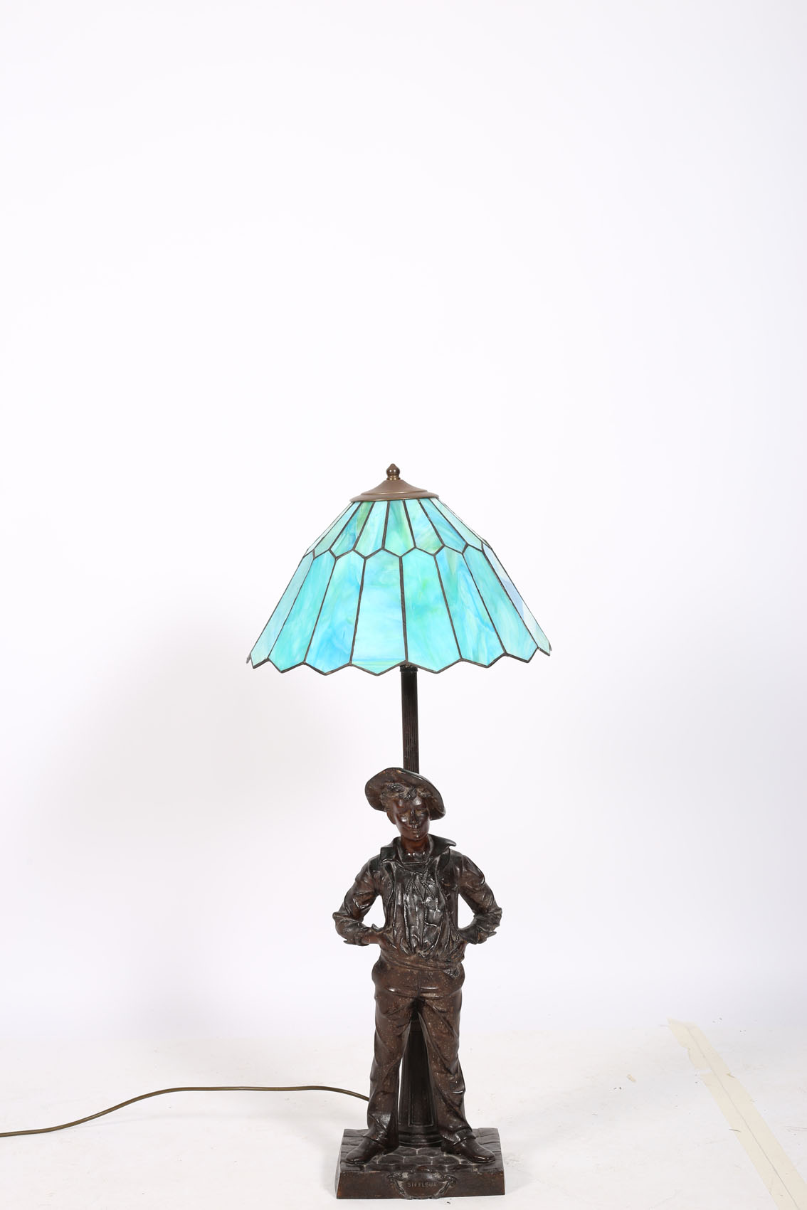 AFTER MILLARD A SPELTER FIGURAL TABLE LAMP modelled as Siffleur shown standing on a naturalistic