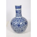A FINE ORIENTAL BLUE AND WHITE VASE of bulbous form the white ground decorated with stylized