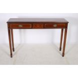 A MAHOGANY INLAID SIDE TABLE of rectangular outline the shaped top with three frieze drawers on