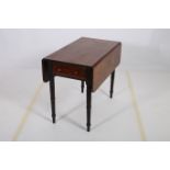 A 19TH CENTURY MAHOGANY DROP LEAF TABLE the rectangular hinged top with frieze drawer on turned