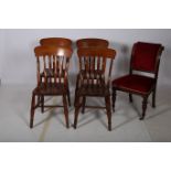 A SET OF FOUR HARDWOOD KITCHEN CHAIRS each with a shaped top rail and vertical splat with panelled