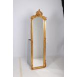 A CONTINENTAL GILT FRAMED MIRROR the rectangular shaped bevelled glass plate within a moulded frame