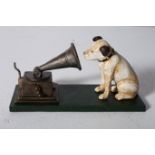 A CAST IRON FIGURE modelled as His Masters Voice 12cm (h)