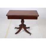 A REGENCY MAHOGANY AND ROSEWOOD CROSS BANDED FOLD OVER CARD TABLE the rectangular hinged top above