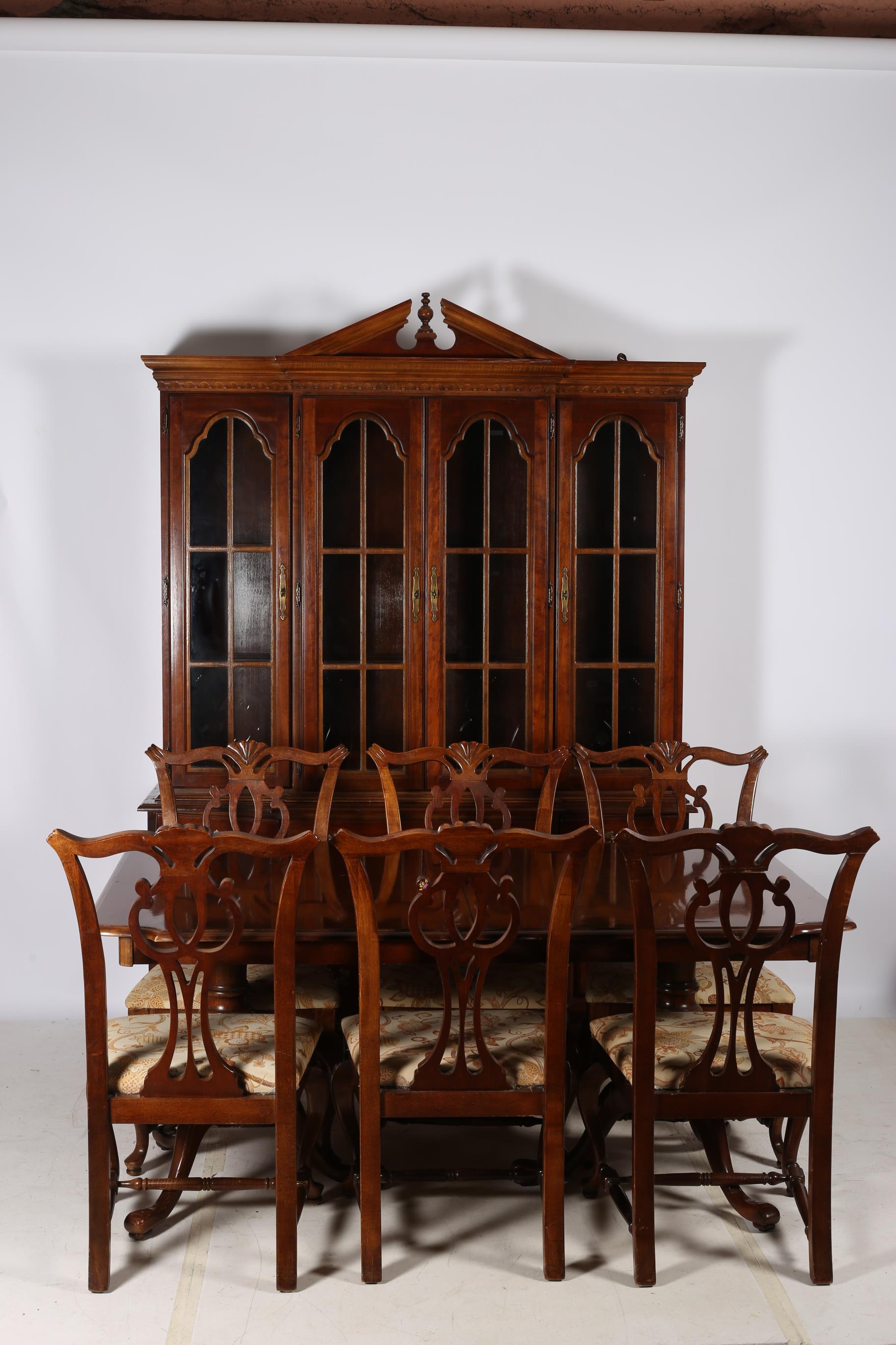 A TWELVE PIECE WALNUT AND MAHOGANY DINING ROOM SUITE comprising ten chairs including a pair of