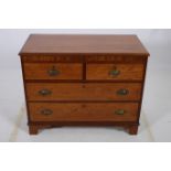 A 19TH CENTURY MAHOGANY CHEST of rectangular outline the shaped top with two short and two long