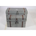 A SET OF THREE GRADUATED ALUMINIUM CHESTS each with rectangular form with hinged lids and metal