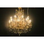 A VERY FINE CONTINENTAL GILT BRASS CUT GLASS SIXTEEN BRANCH CHANDELIER hung in two registers with