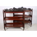 A MATCHED PAIR OF 19TH CENTURY MAHOGANY THREE TIER DUMB WAITERS each with a pierced carved back