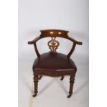 A 19TH CENTURY OAK AND UPHOLSTERED LIBRARY CHAIR the curved back with scroll arms and pierced