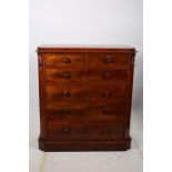 A 19TH CENTURY MAHOGANY CHEST of rectangular outline the shaped top with canted angles above two