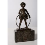 AFTER FERDINAND PREISS A BRONZE FIGURE modelled as a young girl with a hula hoop shown standing on