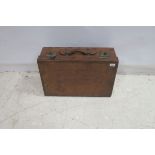 A LEATHER GENTLEMAN'S TRAVELLING SUITCASE with white metal clasps and carry handle 42cm (h) x 60cm