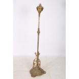 A 19TH CENTURY BRASS FLOOR STANDARD LAMP the reeded knopped column with scroll decoration above a