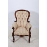 A 19TH CENTURY MAHOGANY AND UPHOLSTERED LIBRARY CHAIR the shaped top rail with button upholstered