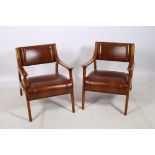 A VERY FINE PAIR OF CHERRYWOOD AND HIDE UPHOLSTERED ARMCHAIRS each with a curved panelled back and