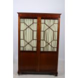 A 19TH CENTURY MAHOGANY DIAMOND DOOR WARDROBE the moulded cornice above a pair of astragal glazed