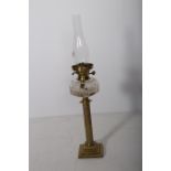 A 19TH CENTURY BRASS OIL LAMP with funnel the circular cut glass bowl above a reeded column on