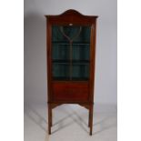 A MAHOGANY INLAID CHINA DISPLAY CABINET of rectangular outline the arched pediment with painted