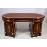 A VERY FINE CONTINENTAL KINGWOOD CROSS BANDED AND GILT BRASS MOUNTED PARTNERS PEDESTAL DESK of oval