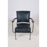 A HARDWOOD BLACK METAL AND HIDE UPHOLSTERED ELBOW CHAIR with a panelled back and seat on