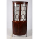 A GOOD GEORGIAN DESIGN MAHOGANY AND SATINWOOD INLAID CORNER CABINET the moulded cornice above a