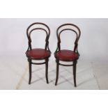A PAIR OF BENTWOOD CHAIRS of typical form with upholstered seats on moulded legs