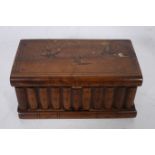 A SORRENTO WALNUT CASKET of rectangular outline the hinged lid inlaid with birds above a mock book
