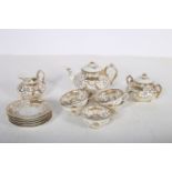 A THIRTEEN PIECE CHINA TEA SET the white ground with gilt overlay