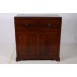 A GEORGIAN MAHOGANY AND SATINWOOD INLAID SECRETAIRE CABINET of rectangular outline the shaped top