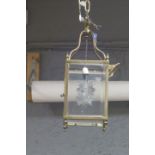 A BRASS AND ETCHED GLASS SINGLE LIGHT HALL LANTERN of rectangular form with urn finials