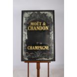 AN ADVERTISEMENT MIRROR inscribed Moet and Chandon Champagne 121cm x 79cm